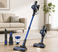 Blue and black cordless vacuum cleaner with attachments on a wooden floor.